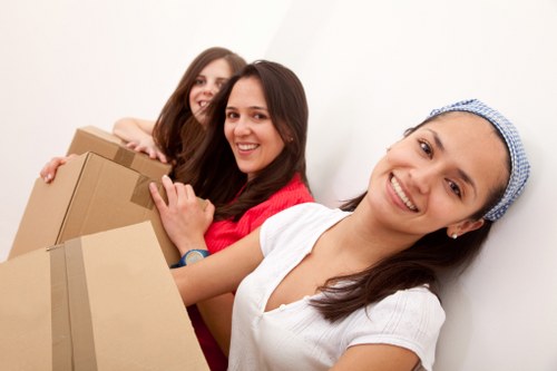 Preparing boxes and furniture for a removals van in The Hale