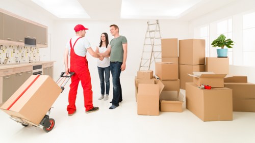 Removal vehicle loading boxes and household items in The Hale