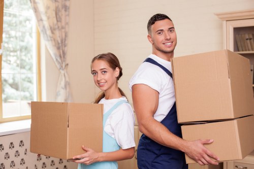 Local moving team loading a truck for a home relocation in The Hale