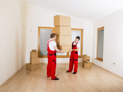 Moving van and boxes prepared for a property move in The Hale